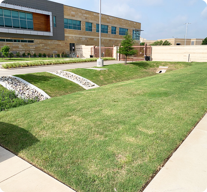 Aerial master planning view of a large brick institutional campus in Dallas with integrated green spaces.